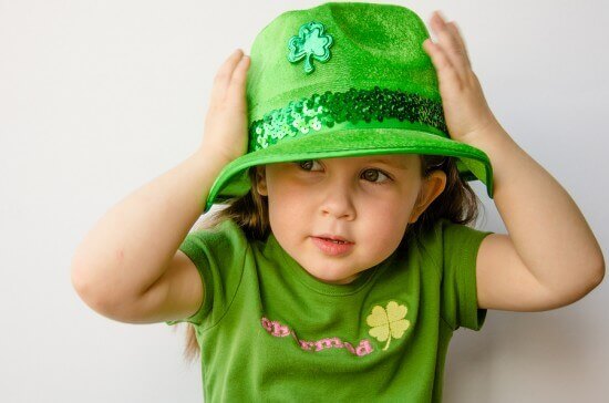 Pretty little girl celebrates St. Patrick's Day with a fancy gre