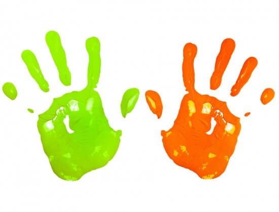Multicolored child hand print isolated on a white paper backgrou