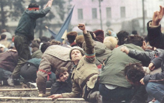 Communism falls in the Eastern Bloc. Revolutionaries on the streets during the Romanian Revolution of 1989.
