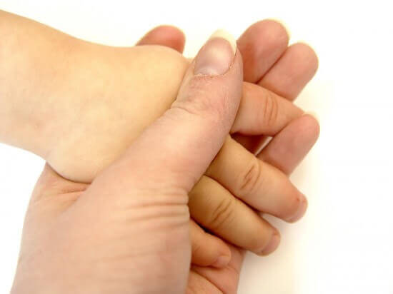 mother and son holding hands isolated on white background